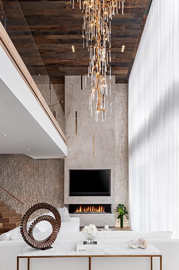 Fireplace and chandelier in luxury home